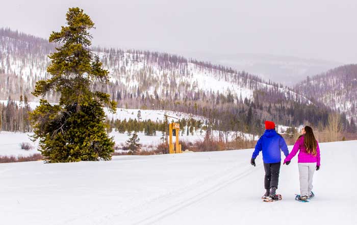 Two snowshoers on the trails at Snow Mountain Ranch