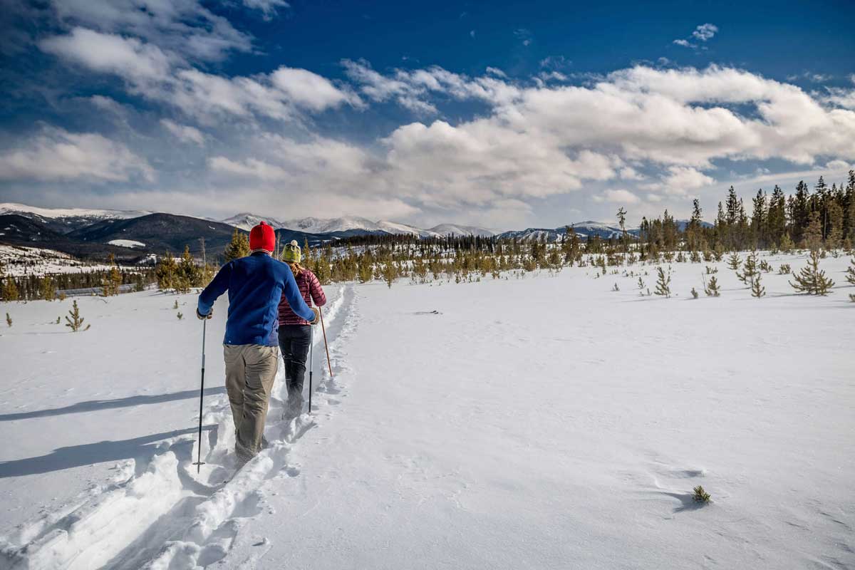 Two snowshoers on the trails at Devil's Thumb Ranch