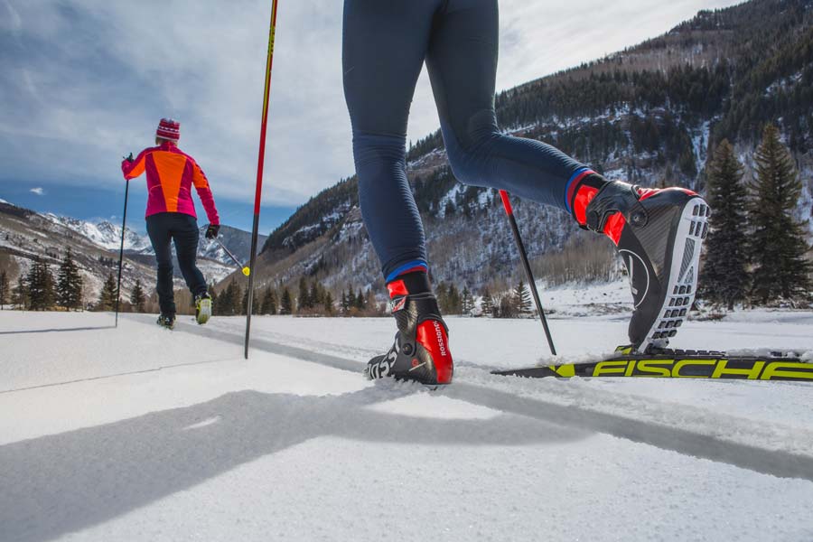 Two nordic skiers on the trails at Vail Nordic Center