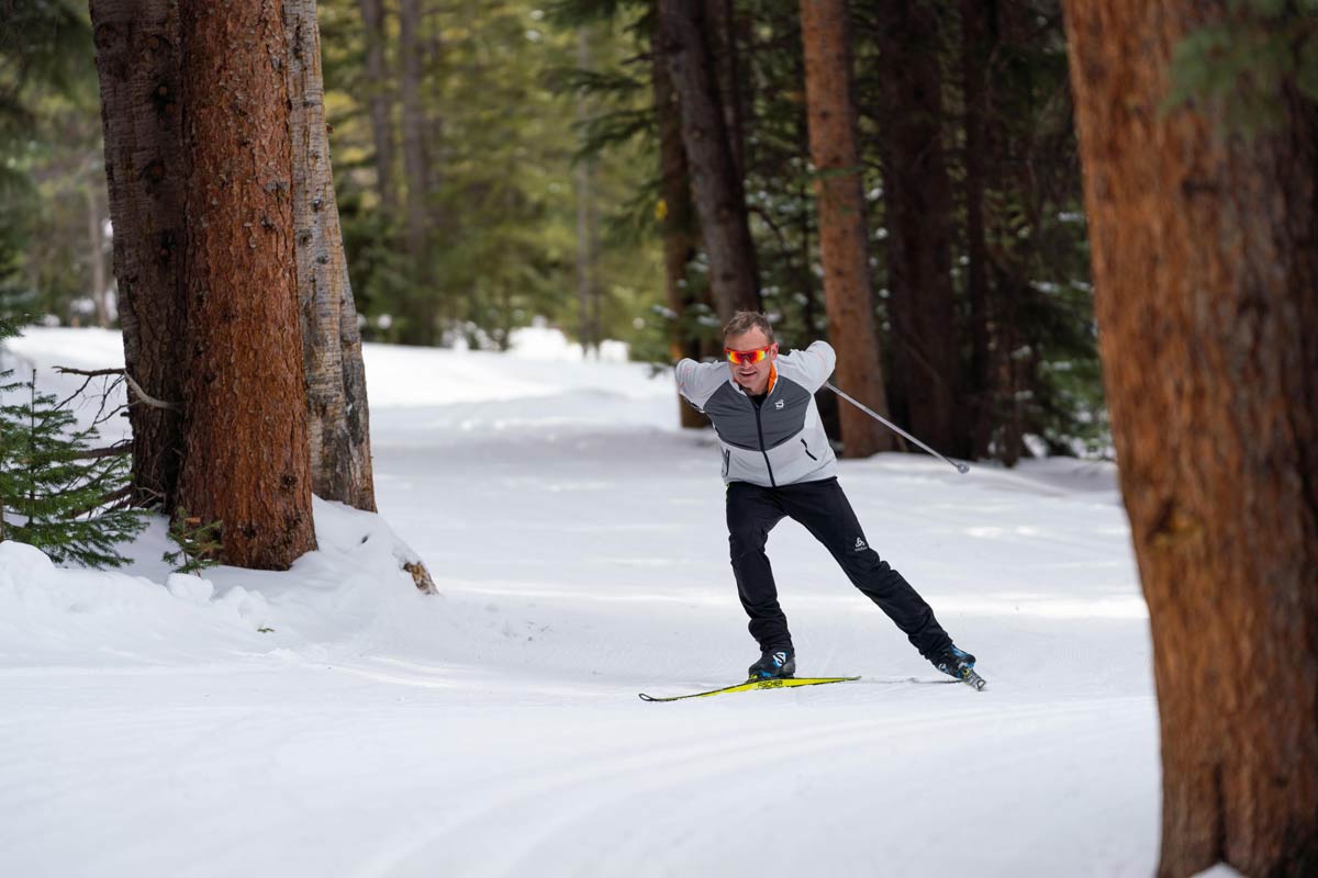 Man skiing on the wooded trails at Breckenridge Nordic Center