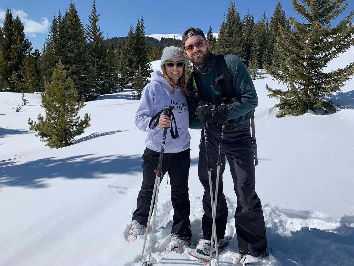 Couple posing for photo while nordic skiing
